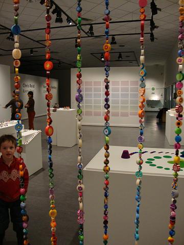 polychrome opening night (6).JPG - Liam checking out the beadology veil before the opening